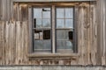 black metal window frame with weathered wood siding Royalty Free Stock Photo