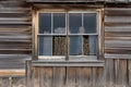 black metal window frame with weathered wood siding Royalty Free Stock Photo