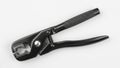 Black metal wire stripper tool on a white background Royalty Free Stock Photo