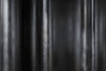 black metallic backrgound texture with curved shapes and soft vertical reflections, 3d
