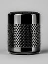 Black Metallic Cylindrical Speaker with Perforated Pattern Royalty Free Stock Photo