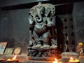 Black metallic statue of lord Ganesh at temple