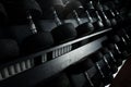 Black metallic or steel heavy dumbbells, weightlifting equipment for weight training, sport