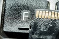 Black micro sd card with gold contacts on the key with the letter F