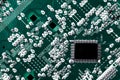 Microchip integrated on green motherboard computer science Royalty Free Stock Photo