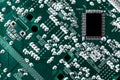Microchip integrated on green motherboard computer science Royalty Free Stock Photo