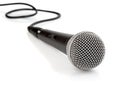 Black microphone with cable isolated Royalty Free Stock Photo
