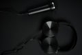black microphone and headphones on a black background Royalty Free Stock Photo