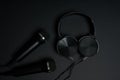 black microphone and headphones on a black background Royalty Free Stock Photo