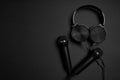 black microphone and headphones on a black background Royalty Free Stock Photo