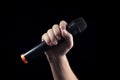 Hand holding wireless microphone Royalty Free Stock Photo
