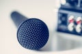 Black microphone and mixer in the blurry background Royalty Free Stock Photo