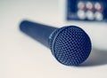 Black microphone and mixer in the blurry background Royalty Free Stock Photo