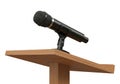 Microphone on a wooden podium isolated on white background Royalty Free Stock Photo