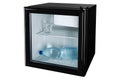 In a black mini bar with a glass door is a bottle of water and a glass full of water, the concept of water and cooling, on a white