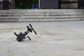 Miniature bike lying on the asphalt