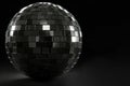 Black mirror ball on a black background. Space for text. Royalty Free Stock Photo