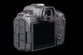 black mirrorless digital camera body Canon R5 without lens isolated on black background