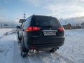 Black Mitsubishi Pajero Sport in winter weather