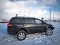 Black Mitsubishi Pajero Sport in winter weather