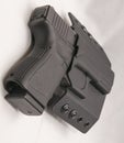 A black 9mm pistol in a black holster Royalty Free Stock Photo