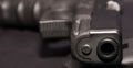 A black 9mm semiautomatic pistol laying in it`s side