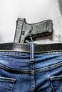 Black 9mm in waistband view from behind