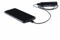 Black mobile phone and charger isolated on white background.Copy space Royalty Free Stock Photo