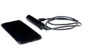 Black mobile phone and charger isolated on white background.Copy space Royalty Free Stock Photo