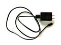 Black mobile phone cord AC charger and USB cable. Royalty Free Stock Photo