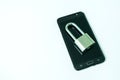 Black mobile phone with padlock and key isolated Royalty Free Stock Photo