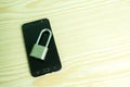 Black mobile phone with padlock and key isolated Royalty Free Stock Photo