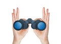 Black modern binoculars in hands isolated