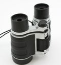 Black modern binoculars, standing