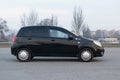 Black modern city car compact hatchback side view Royalty Free Stock Photo