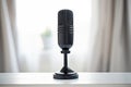 a black modern microphone on a white table Royalty Free Stock Photo