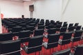 Black modern seats armchairs in conference room. Interior of conference or business hall. selective focus Royalty Free Stock Photo