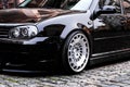 Black modern sports car parked on the street in the city center. alloy wheels on a car Royalty Free Stock Photo