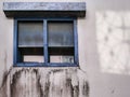 Exterior of old tropical house with black mold and cement crack on wane wall outside bathroom Royalty Free Stock Photo
