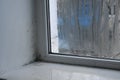 black mold near the fogged window. Royalty Free Stock Photo