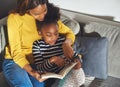 Black mom learning daughter to read Royalty Free Stock Photo