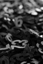 Black monochrome colored random digit metal numbers heap background, algebra, education or science concept Royalty Free Stock Photo