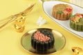 Black Mooncake on Light Yellow Background with Gold Dusting Concept Moon Cake on Mid Autumn Festival