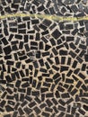 Black Mosaic tiles on the wall of the house. Architectural abstract background texture. Gray concrete Royalty Free Stock Photo