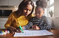 Black mother and child doing homework