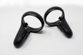 Black motion controllers with triggers, buttons, analog sticks and touch. Made for virtual reality video games