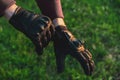 Black motorcycle gloves guy puts on his hands for safety close up Royalty Free Stock Photo