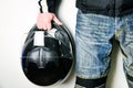 Black motorcycle helmet in biker`s hand Royalty Free Stock Photo