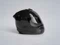 Black motorcycle helmet isolated on grey Mockup 3D rendering Royalty Free Stock Photo