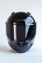 A black motorcycle helmet is sitting on a white background. Generative AI Royalty Free Stock Photo